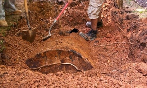 digging up an underground oil tank